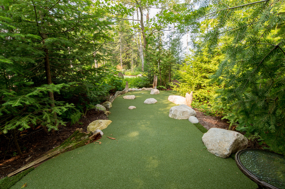 custom outdoor putting green in Northern Michigan home